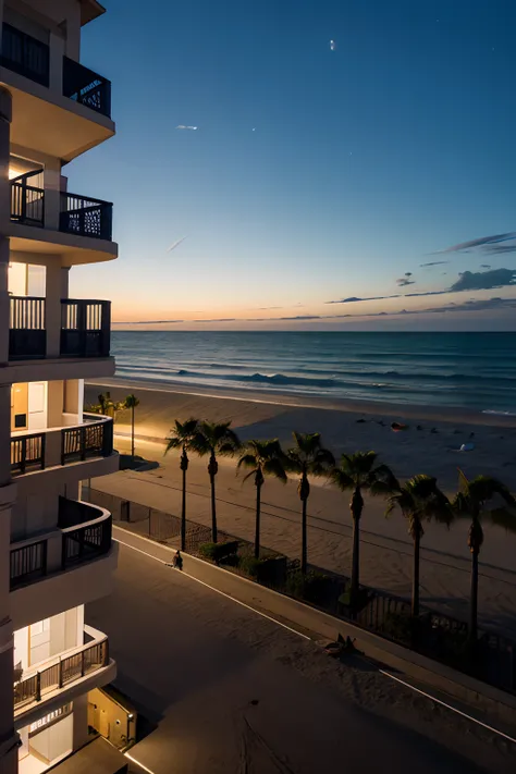 Beach at night seen from a balcony of a building