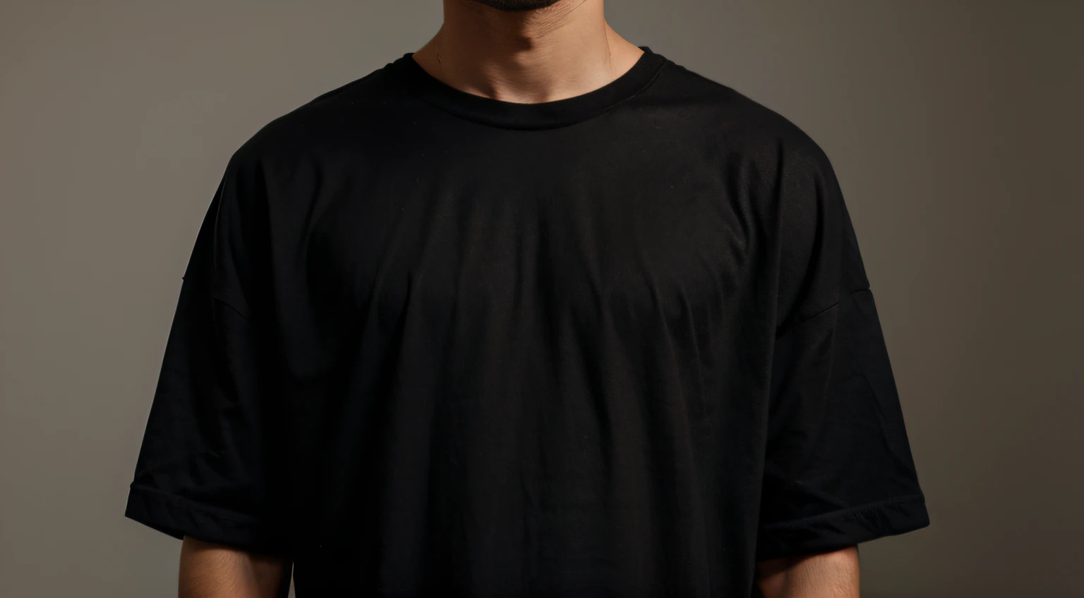 A model of a Man with black oversize T-shirt