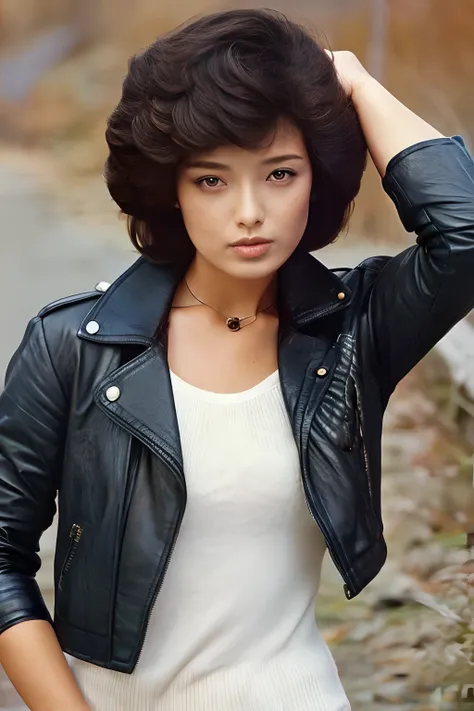 a woman in a worn leather jacket posing for a picture, 70's japanese idol, style of kishin shinoyama, with curly short hair