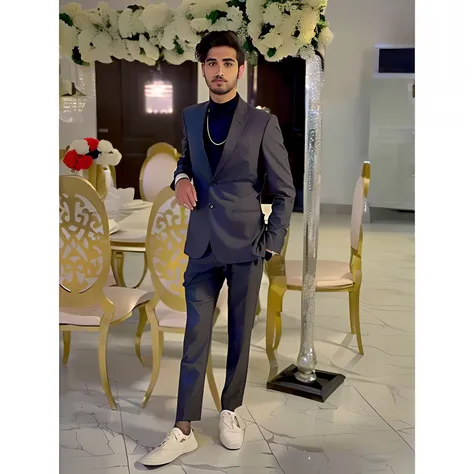 there is a man in a suit standing in front of a table, mohamed chahin style, elegant suit, luxurious suit, stylish suit, grey suit, formal attire, in a suit, wearing fashion suit, formal suit, well - dressed, well dressed, wearing suit, wearing black grey ...