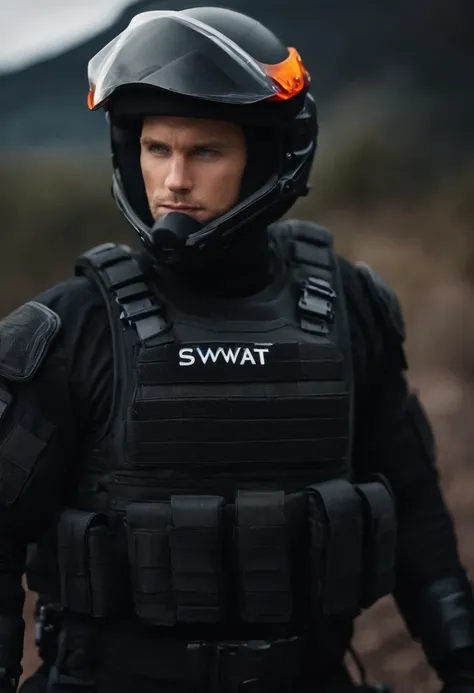 An adult man with blond hair and blue eyes wearing a black SWAT suit