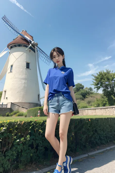 A woman in a blue shirt and shorts stands in front of a windmill, ChineseGirl, xintong chen, Gorgeous young Chinese woman, Beautiful young and middle-aged woman, Beautiful middle woman, gorgeous chinese models, xision wu, wenfei ye, Chinese girl, Beautiful...