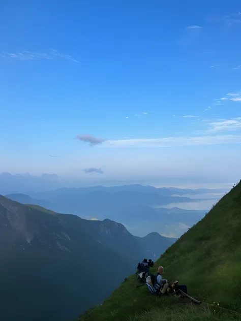 On a sunny day，Someone is sitting on the hillside, 8 k. filling of the view, 8 k. filling most of the view, Far view, Faraway view, Distant view, Landscape view, on deep forest peak, View, taken on iphone 1 3 pro, panorama distant view, taken on iphone 14 ...