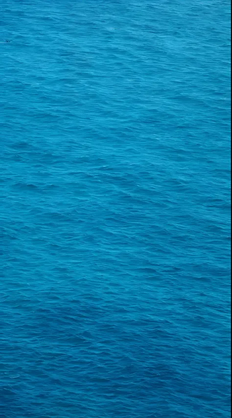 There is a man on a surfboard in the middle of the ocean, Blue sea, Blue ocean, Deep blue sea color, dark blue water, Deep blue ocean, a photo of the ocean, photo of the middle of the ocean, Blue water, Dark blue ocean color, Detailed sea, an ocean, ocean ...