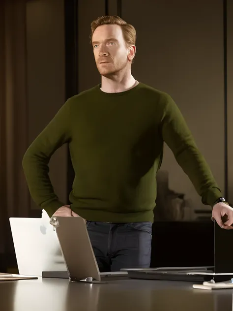 arafed man standing in front of a desk with a laptop, promo still, tv show still, ewan mcgregor, wearing a black sweater, wearing a dark sweater, promo shot, promo image, wearing a green sweater, promotional still, tv still, michael fassbender, promotional...