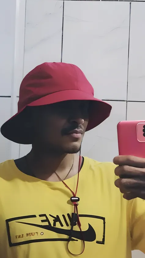 there is a man taking a selfie in a bathroom with a cell phone, he has a red hat, wearing a red backwards cap, red hat, Red cap, he is wearing a hat, reflexo do telefone na viseira, with hat, vermelho amarelo, with a weird hat, vestindo roupas vermelhas e ...