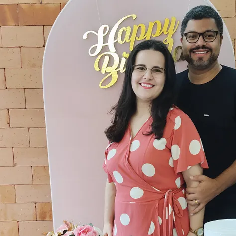 Smiling couple standing in front of a happy birthday sign, Casal feliz, Directed by: Márta Lacza, Directed by: Nandor Soldier, Malika Favre, In Sao Paulo, Lovely couple, edu souza, he is! cerca de 3 0 anos de idade, andrea rocha, happy birthday, Directed b...