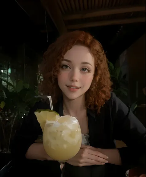 woman with curly hair, short red hair and a glass of drink in front.