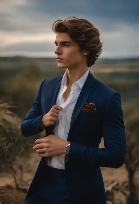 A teenage boy in a navy blue suit with flowy brown hair in a royal pose