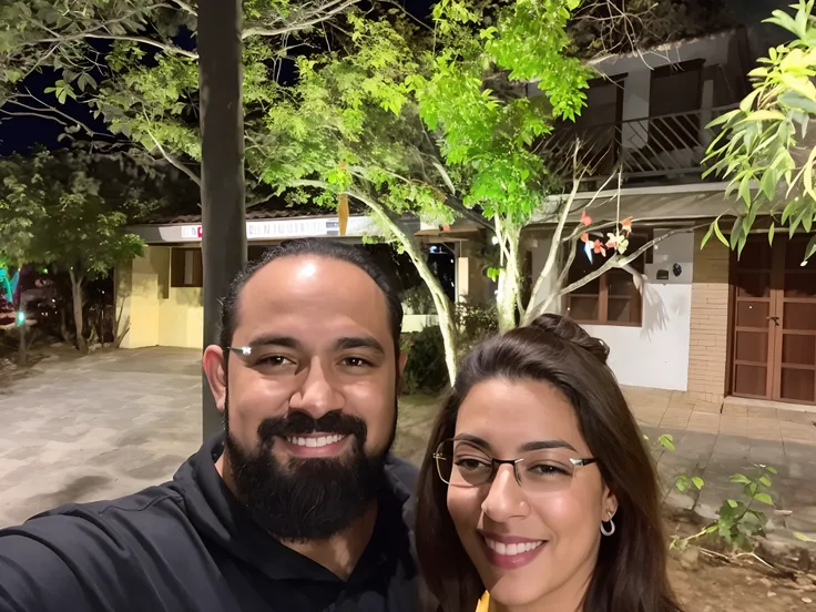 they are posing for a picture in front of a tree, photo taken at night, imagem de perfil, Directed by: Nandor Soldier, Noite!, foto do perfil, In Sao Paulo, taken in the night, Karla Ortiz, with a tree in the background, trees in the background, in front o...