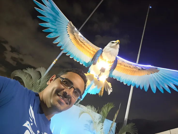 Man in blue shirt standing in front of a bird statue, with a giant robot owl, imagem do avatar, with great birds, com um papagaio grande, flying around the bird, com asas reais, Raziel IRL, photo taken at night, ophanim has bird wings, with the beak of an ...