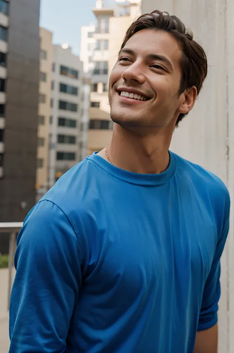 Man looking up with blue shirt smiling