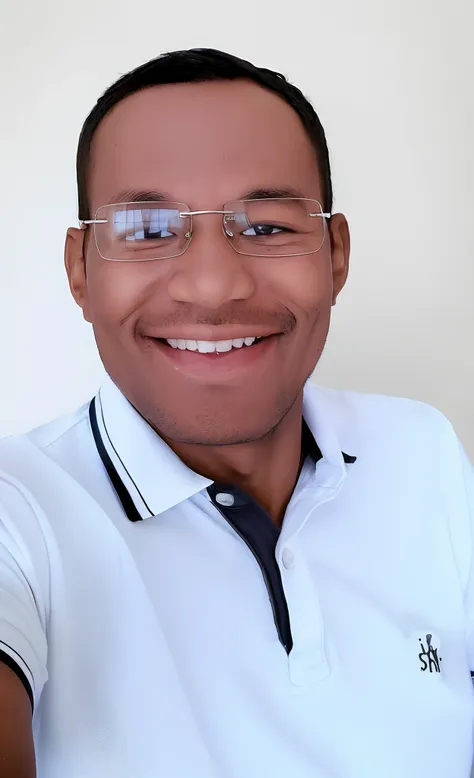 dark-skinned man, 33 years old, smiling wearing glasses and a white polo-neck shirt