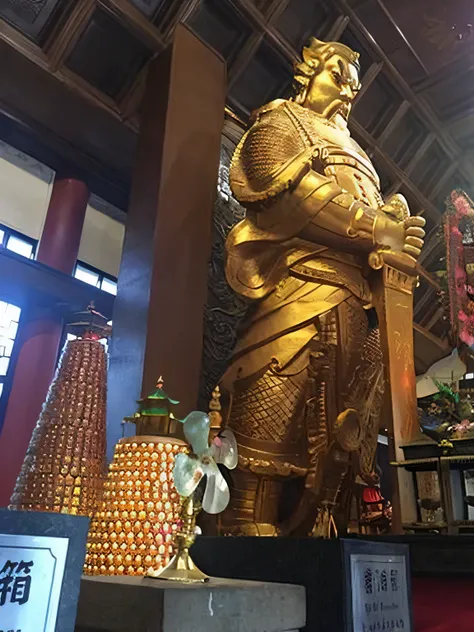 arafed statue of a man in a gold outfit in a building, vietnamese temple scene, buddhist temple, in a temple, guan yu, standing in a buddhist temple, huge statues, guanyin of the southern seas, chinese temple, taoist temples and monks, attractive male deit...