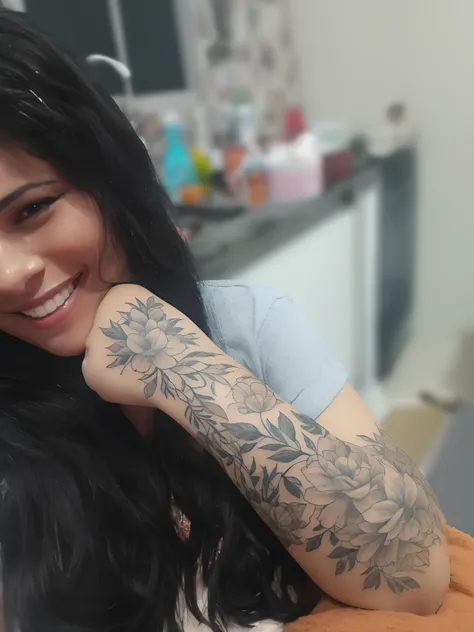 Theres a woman with a tattoo on her arm smiling, Directed by: Emerson Silva, Directed by: Nandor Soldier, Directed by: Ramon Silva, tattoo sleeve on her right arm, Directed by: Samuel Silva, by João Artur da Silva, tato, Coberto, Directed by: Willian Murai...