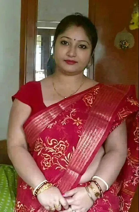 arafed woman in a red sari posing for a picture, very very beautiful woman, wearing bihu dress mekhela sador, indian goddess, traditional beauty, south east asian with long, indian, assamese, 3 0 years old woman, with lovely look, 30 years old woman, very ...