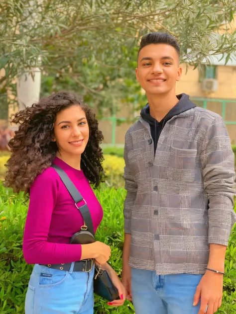 Boyfriend with girlfriend in love in garden girl with short curly hair pink blouse and jeans belt Crossbody bag for a boy with short hair, a black sweatshirt, a gray checkered jacket, and jeans