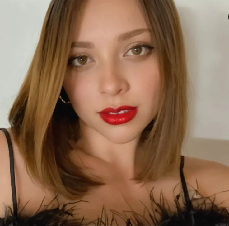 arafed woman with red lipstick and a black dress posing for a picture, thick red lips, small and thick red lips, portrait sophie mudd, sexy red lips, red lips, red lipstick on face, headshot profile picture, sultry look, wide golden eyes and red lips, fain...