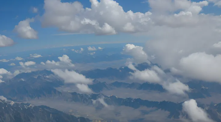 View from an aircraft flying 8000m looking down 45 degrees at a mountain range, clouds, sky view