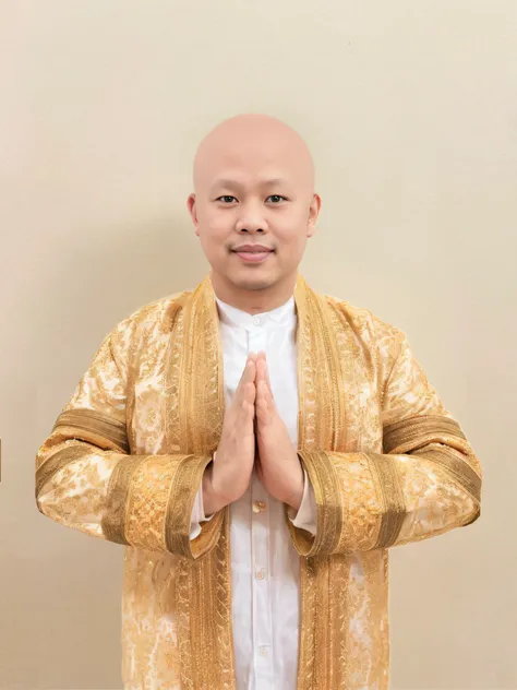 There was a man with a bald head and a gold jacket..., sukhothai costume, nivanh chanthara, Wear traditional costumes..., in style of thawan duchanee, thawan duchanee, Portrait of a bald head, Inspired by I Ketut Soki, patiphan sottiwilaiphong, south east ...