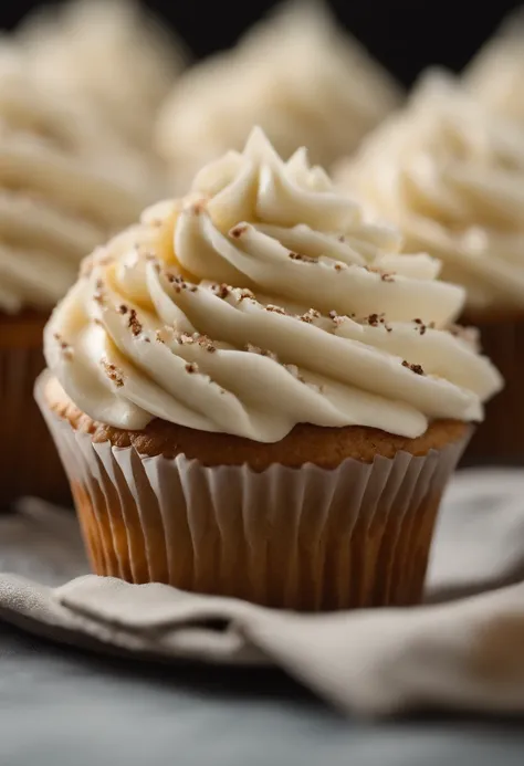 Capture a detail shot of a perfectly frosted cupcake, showcasing the intricate piping work and decorative elements that make it a visually appealing and sweet snack