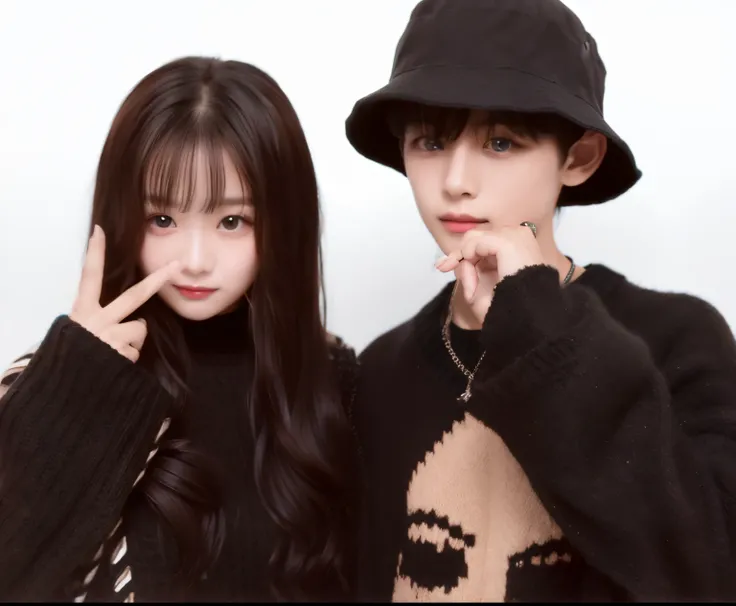 A girl with long hair wearing a pieced black knit and a boy wearing a bucket hat and knit