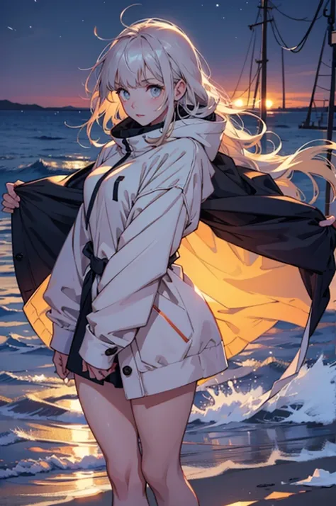 Beautiful young girl in oversized winter clothes and hair floating on the beach at night,