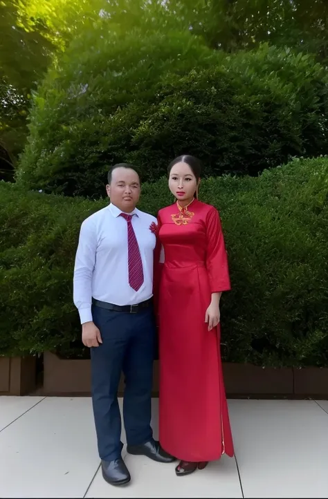 they are standing in front of a hedge and bushes, momma and papa, ao dai, profile image, profile picture, mai anh tran, ngai victo and dougherty patrick, wearing red formal attire, bao pham, wearing red attire, a picture, taken in the early 2020s, photo ta...