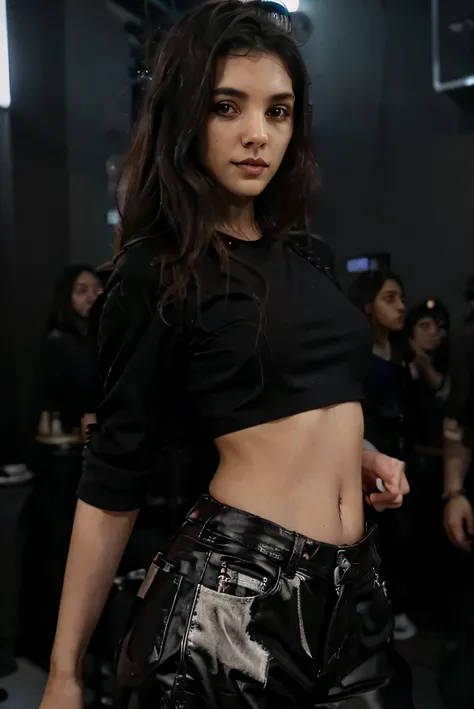 a girl wearing black crop top and standing in club