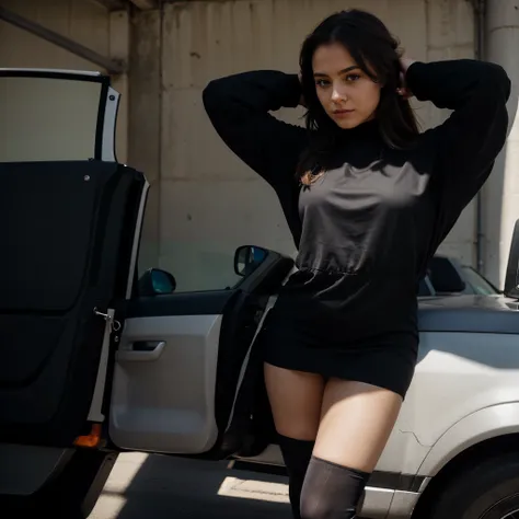 Beautiful girl in black dress in black tights with her hands behind her head near the police car