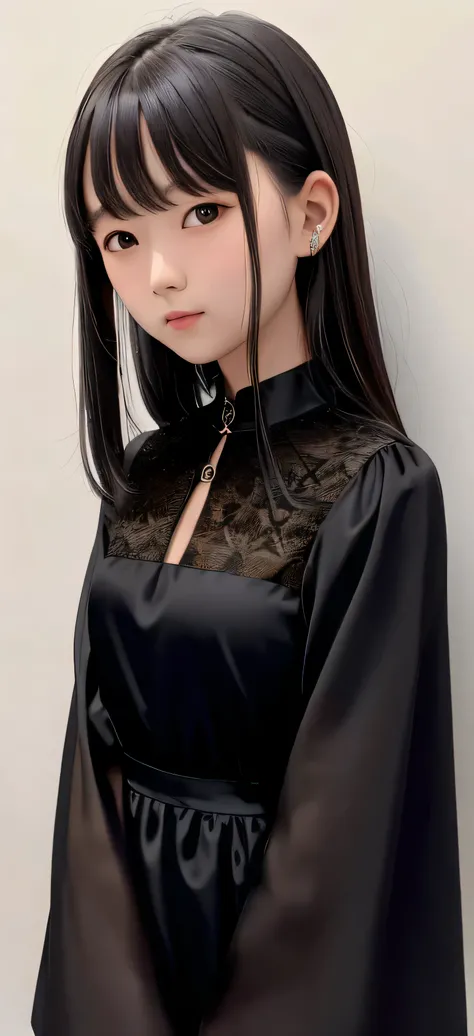 portrait image for a girl wearing silky black dress shows part of her shoulders 