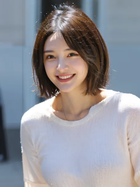 A woman with very, very short hair smiles