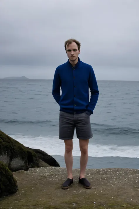 realistic ,a belgian man with short blond hair stands in front of the sea.