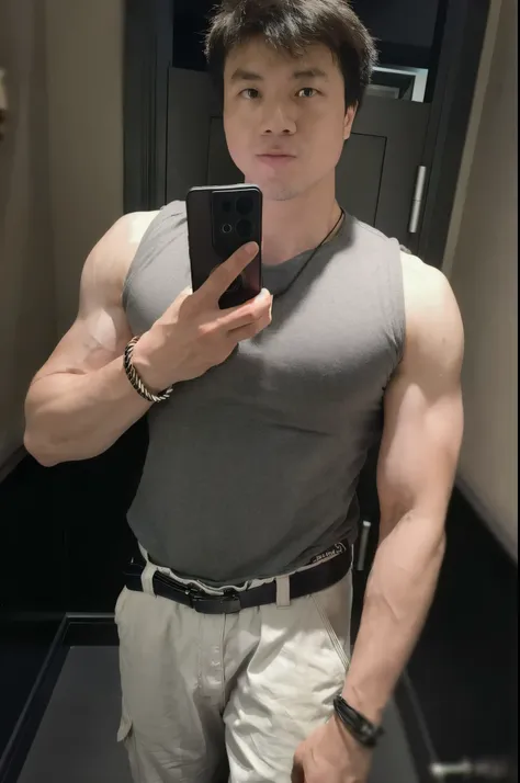 man taking a selfie in a mirror in a bathroom, shoulders can be seen, showing off biceps, wearing a tanktop, big arms, wearing t...