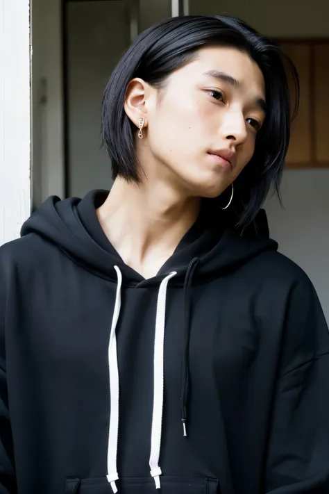 Japanese young man black hoodie earrings shaved black hair long hair tied up handsome man no beard fair skin