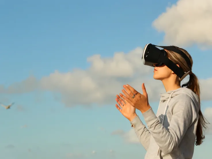 woman wearing virtual reality headset standing on beach with birds flying in the background, wearing a vr headset, wearing a vr-headset, virtual reality, wearing vr goggles, using a vr headset, wearing vr glasses, virtual reality headset, wearing vr, vr go...