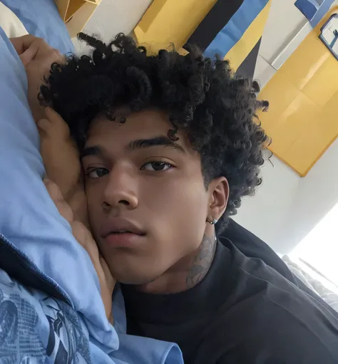 there is a young man lying in bed with his head resting on the pillow, taken at the beginning of 2020, adolescente negro, photo Not Tyler Mitchell&#39;s style, Not Tyler Mitchell&#39;s style, Tommy 1 6 anos, curls on top of the head, xxxtentacion, ele tem ...