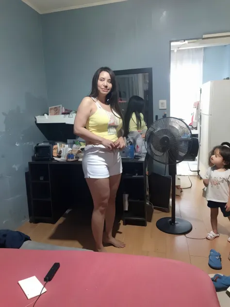 Theres a woman standing in a room with a fan, 3 Brazilian mother of 5 years, Mulher de 3 0 anos, mulher de 30 anos, Mulher de 30 anos de Cuba, ela tem cerca de 30 anos, ela tem cerca de 3 0 anos, powder Nándor Katona, ela tem cerca de 4 0 anos