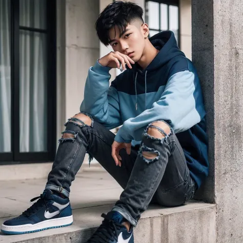 A young Asian man with short undercut hair, wearing a dark blue and light blue hoodie, black ripped slimfit jeans, Nike Air Jordan shoes, standing and leaning against the wall of the terrace in the evening, the photo is very realistic, highly detailed, in ...