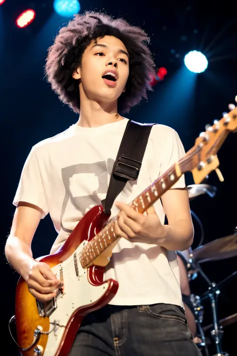 Young man singing with an electric guitar