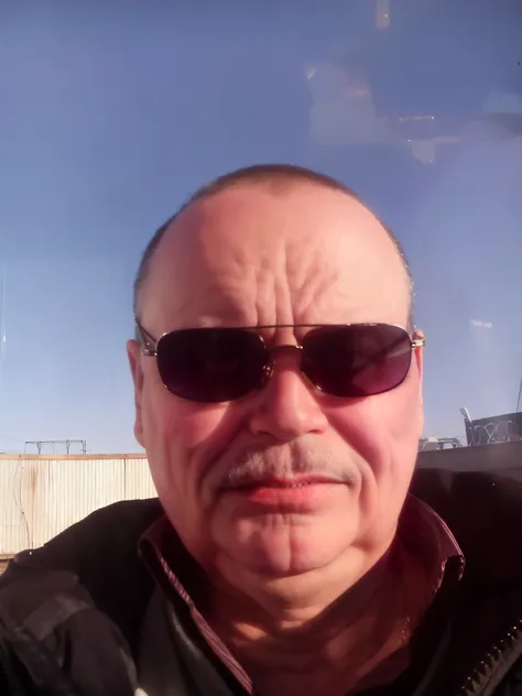 Arafed man in sunglasses and mustache in car, he is about 60 years old, He is about 50 years old, He is about 50 years old, he is about 60 years old, Encho Enchev, he is about 7 0 years old, photo of a 50 year old white man, 5 0 years old male