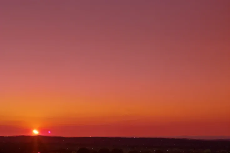 sunset background: warm, The sky is gradated with shades of orange., pink, and purple.