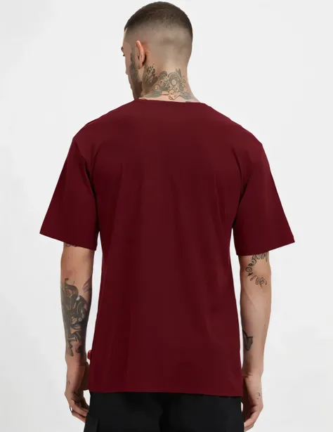 a man wearing a maroon t - shirt with a tattoo on his chest, red t-shirt, maroon red, t-top, red shirt, back view, back view also, view from back, back, 3 / 4 back view, back - view, backview, view from the back, rich red, long shot from the back, long str...