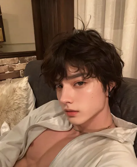 sharp man lying on a sofa, Jeon Jungkook, BTS, ele tem cabelo castanho curto e encaracolado, handsome androgynous prince, delicate androgynous prince, homem de 27 anos