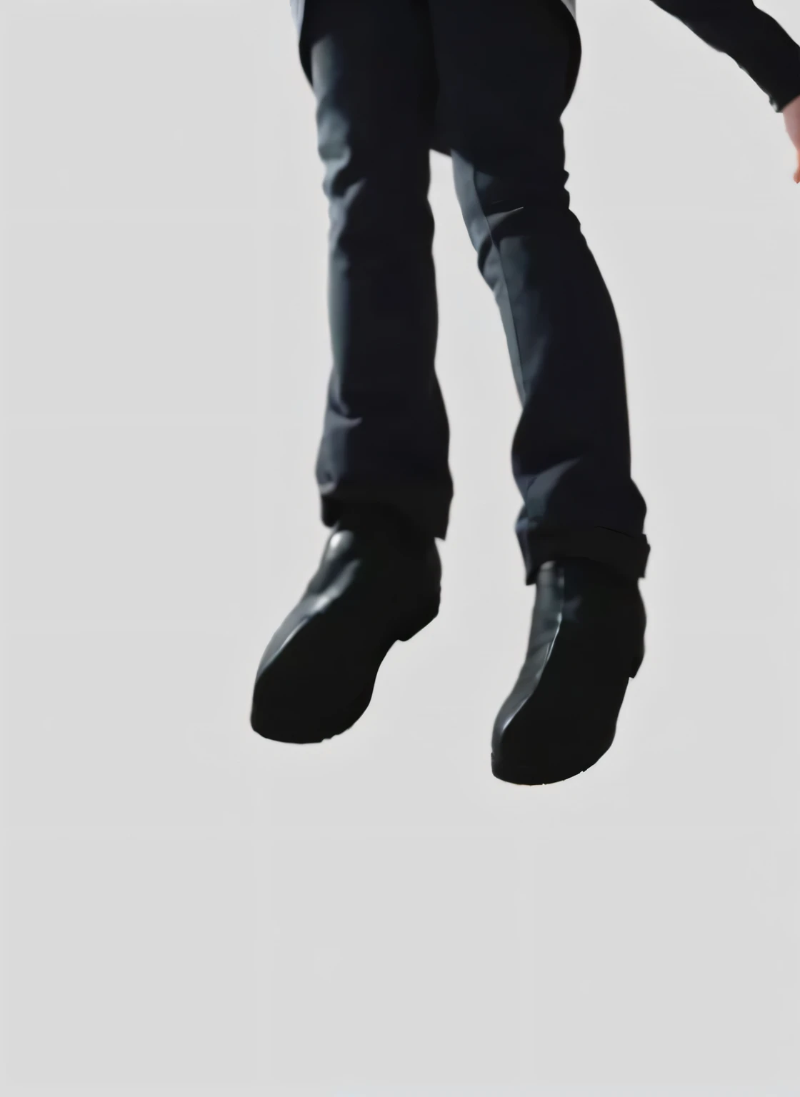 A man wearing black pants and black shoes 