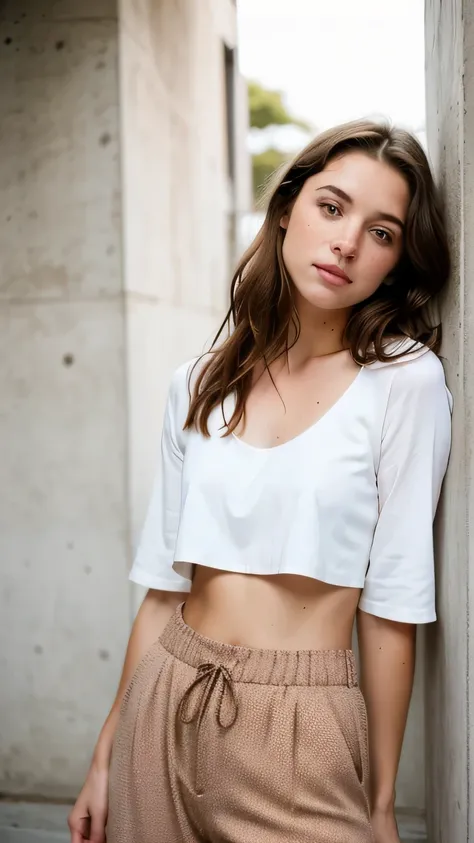 woman in a white full sleeve crop top and brown pants posing for a picture, with long brown hair, 🤤 girl portrait, cait miers, small freckles, rosey cheeks, long brown hair and beautiful eyes, cute freckles, natural short hair, no makeup wavy hair, portrai...