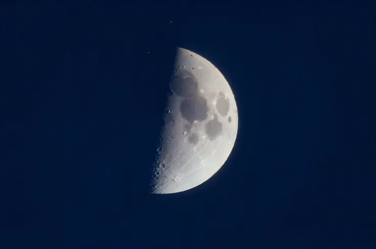 arafed half moon in the blue sky with a cloudless cloud, waxing moon, waning moon, the moon in the background, moon in the background, crescent moon in background, moon in background, halfmoon in space, large moon in the sky, moon, the moon on the top righ...