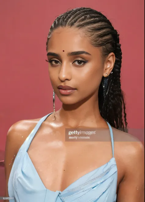 a close up of a woman with a braided ponytail and a blue dress, gettyimages, getty images, she has olive brown skin, imaan hamma...