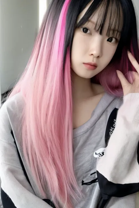 Her hair is long and half pink and half black.