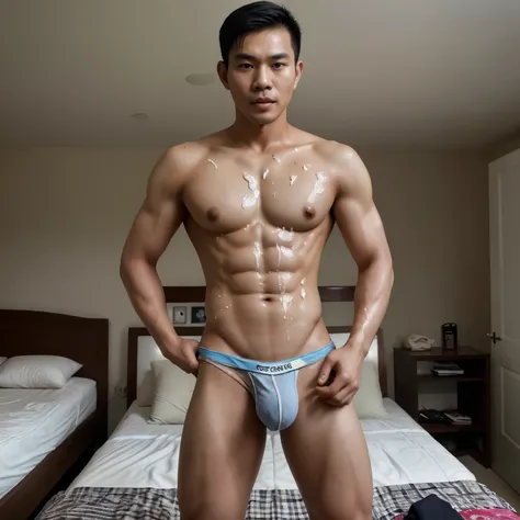 A handsome Thai man with a six-pack stands in his bedroom wearing underwear and cum all over his stomach.